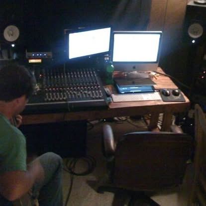 An early recording session at the mixing desk